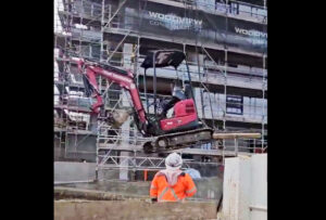 Craning Backhoe into place